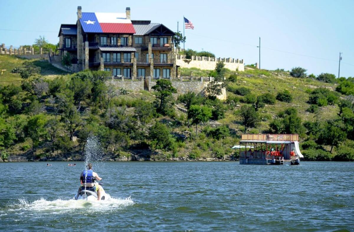 This house with the Texas flag on its roof was rebuilt after the 2011 wildfires.