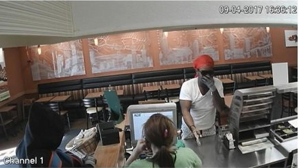 Two suspects caught on surveillance video during a Subway robbery on Monday.