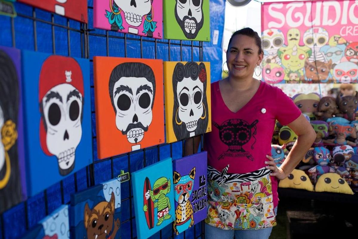 A local artist showcases her work at a previous year’s ArtsGoggle.