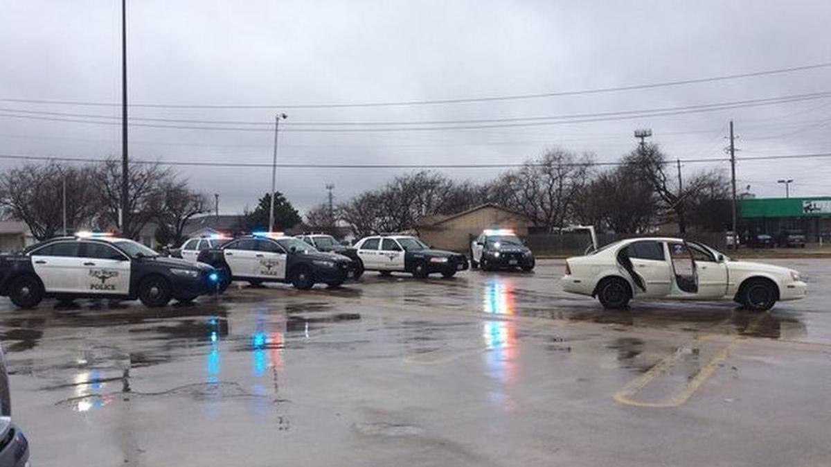 South patrol and fugitive officers converging on a car occupied by capital murder suspect Aaron Rios.