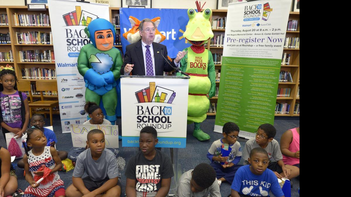 
Tarrant County Judge Glen Whitley talks about the 11th annual Tarrant County Back to School Roundup at Dunbar High School library in Fort Worth on Wednesday. 
