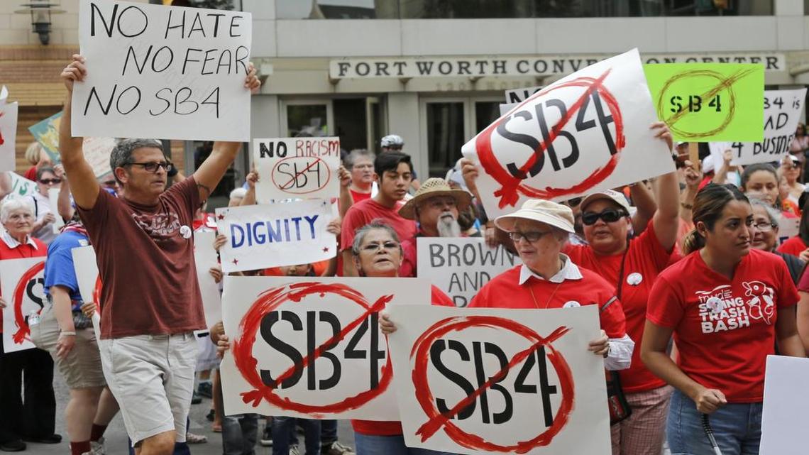 A crowd passes the Fort Worth Convention Center Tuesday during a “Day of Action” to protest Senate Bill 4.