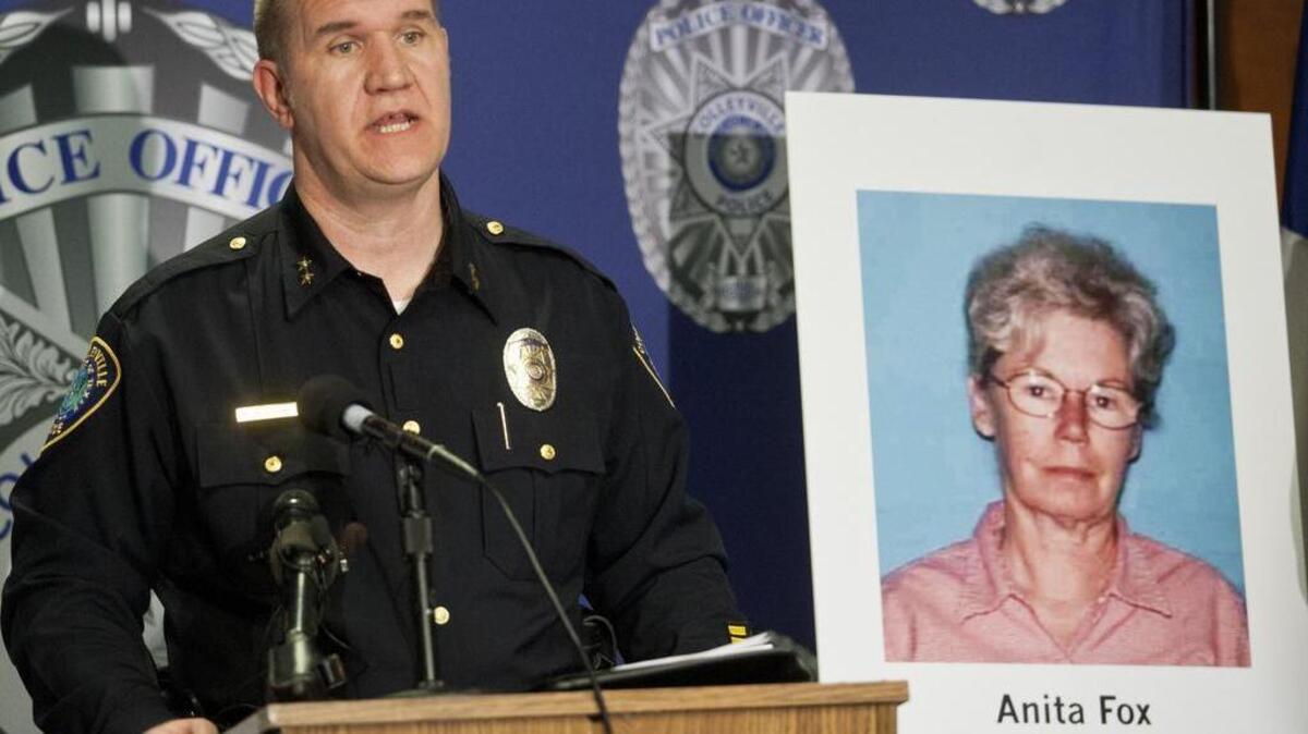 Police Chief Michael Holder talks about the Anita Fox case on Feb. 18, 2015 at the Colleyville Police Station. In the background, a photo of the victim, Anita Fox, is seen.