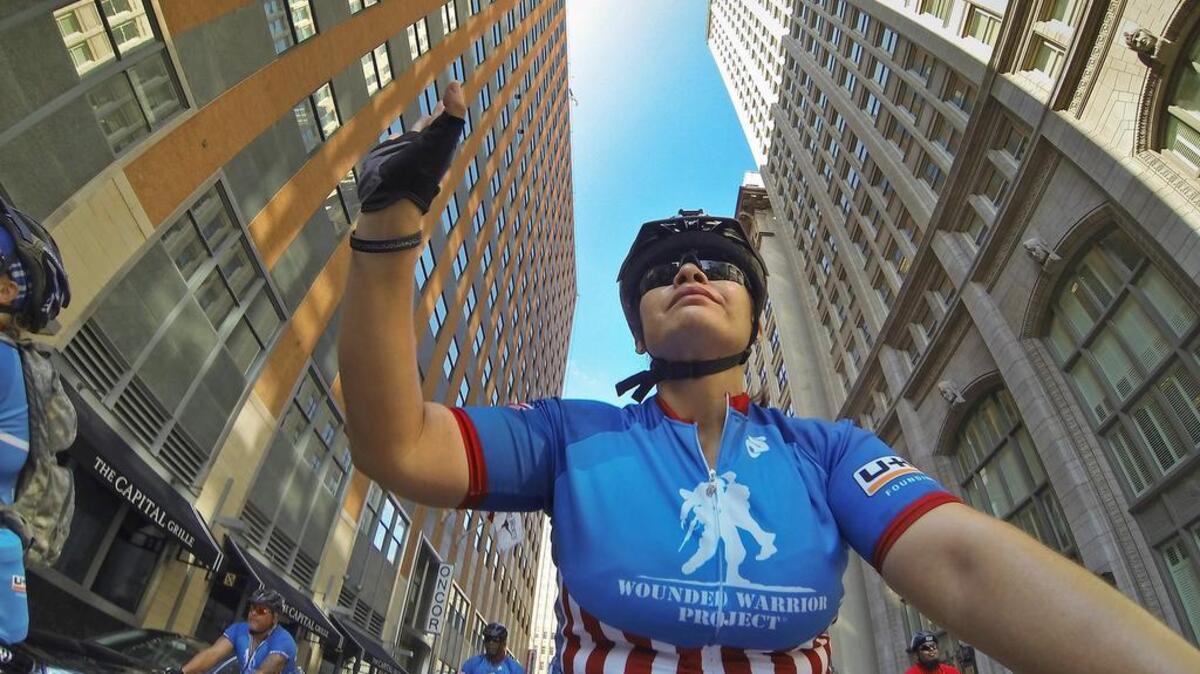 
Former U.S. Army Staff Sgt. Rosa Villanueva waved to citizens as she rode through downtown Fort Worth. 
