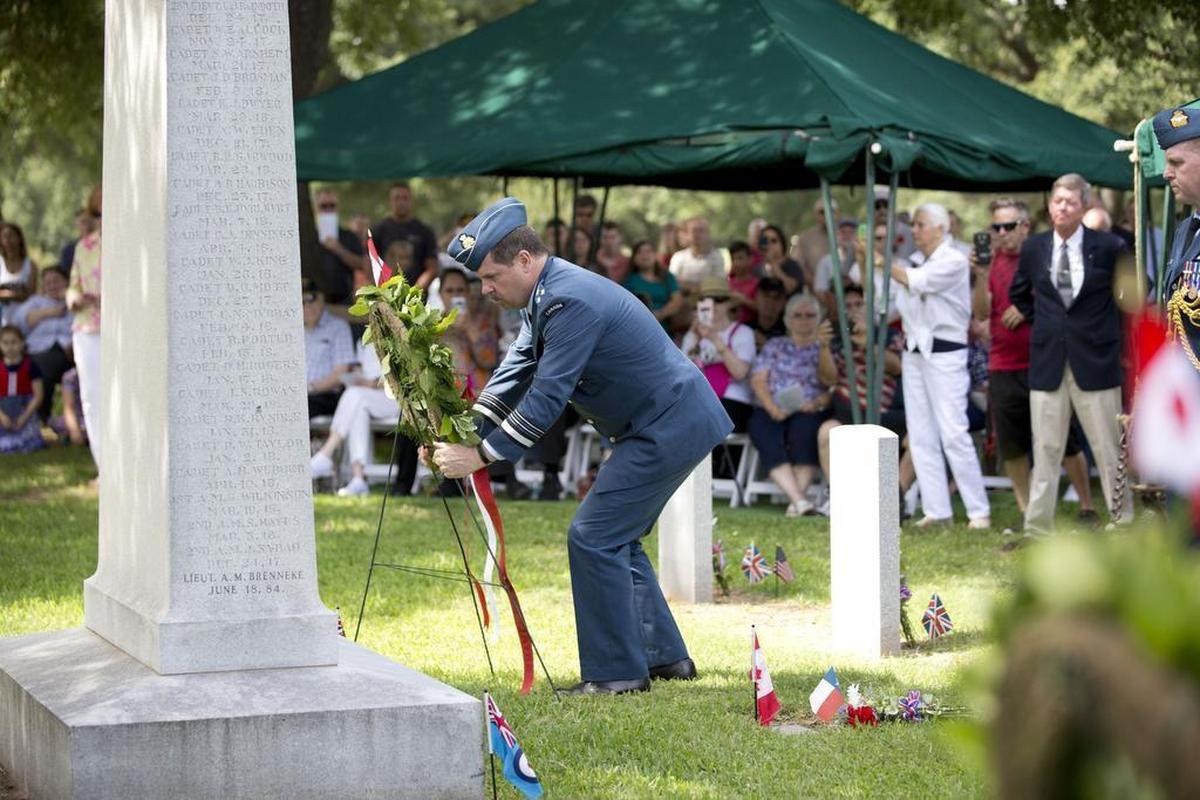 Lt. Gen. Pierre St-Amand, Royal Canadian Air Force, lays a wreath during the 100th Remembrance Service for the Royal Flying Corps Cemetery at Greenwood Memorial Park on Monday.