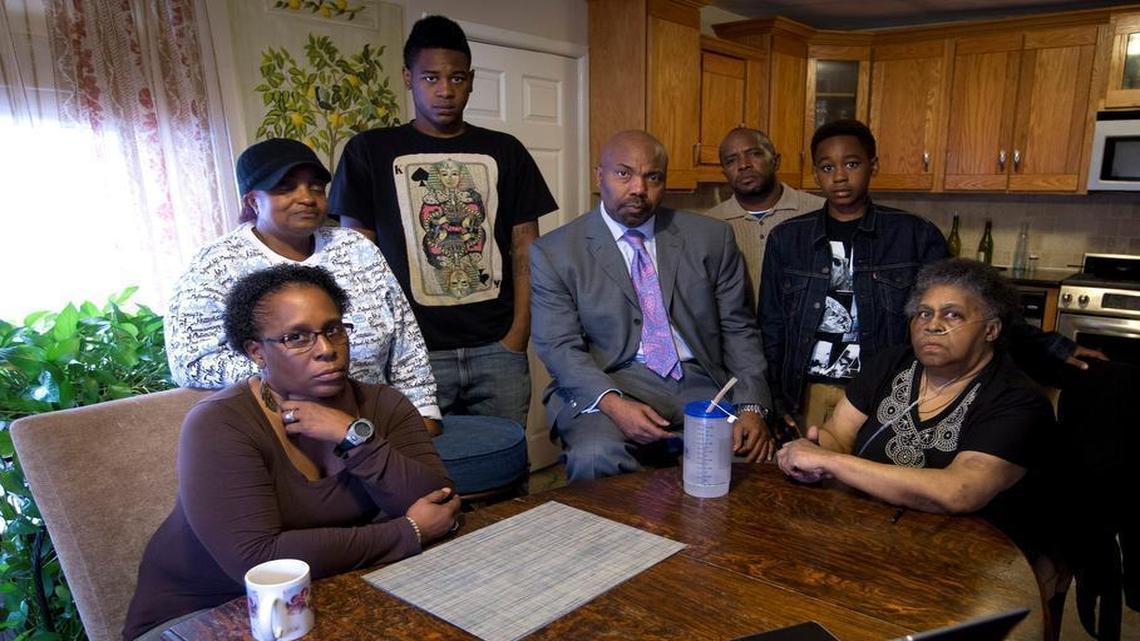 Relatives of Jermaine Darden gathered on Nov. 13, 2014, to comment on a police video of the raid a year earlier that ended with Darden’s death. Attorney Daryl Washington is in the center in gray suit.