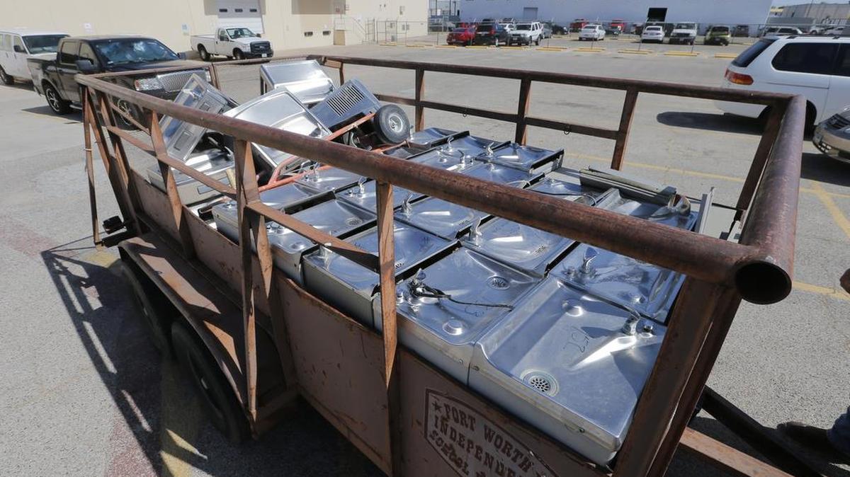 A trailer is loaded with water fountains from several Fort Worth school districts that have been removed for safety reasons.