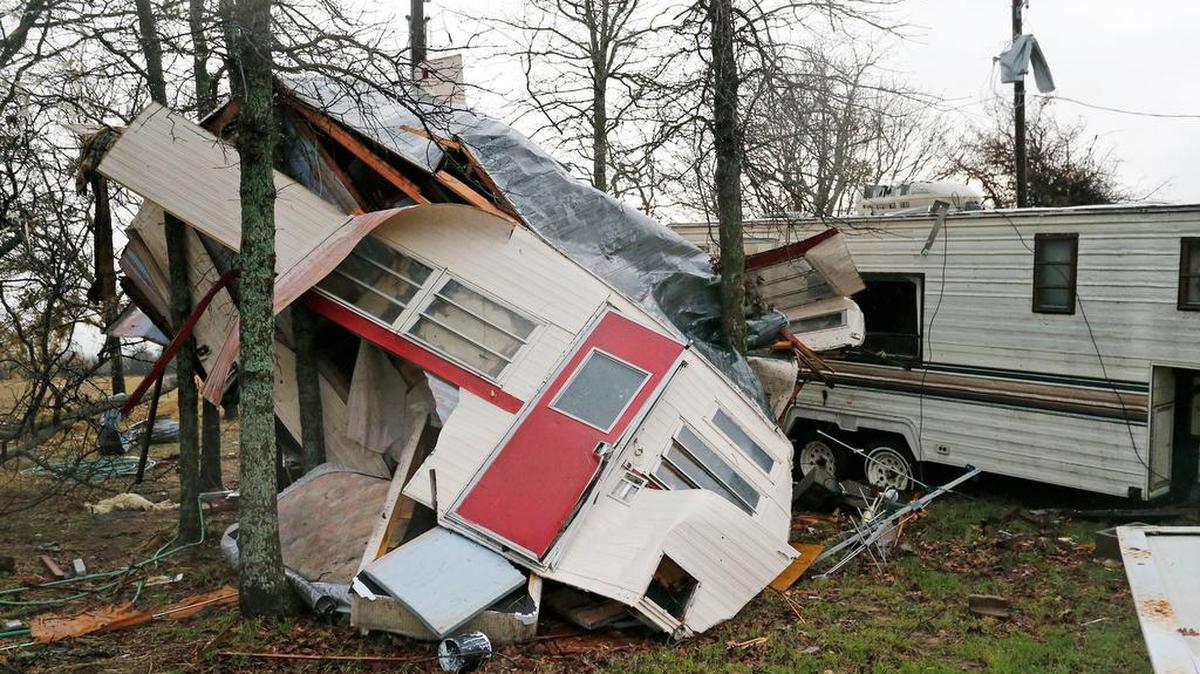 A trailer was smashed between trees Tuesday morning by a tornado that touched down in Tolar at 7:21 a.m. Tuesday, March 8, 2016.