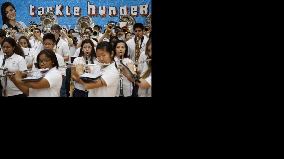 
Members of the Lamar High School Band perform during the Souper Bowl of Caring event at Arlington, Texas school on Friday, Jan. 16, 2015. 
