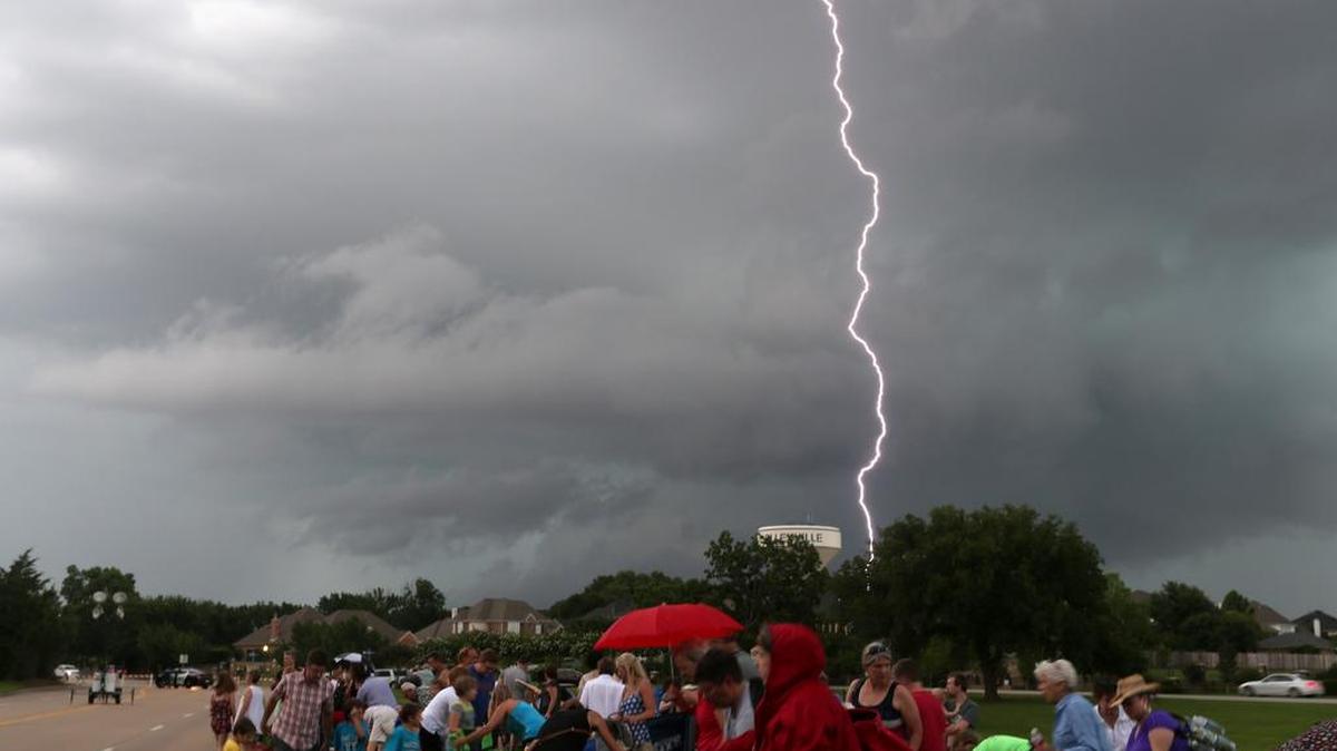 
Stormy weather could return this fall if forecasters are correct. Here, people who came for the Red, White and Sousa event on June 26 seek shelter as a thunderstorm with lightning rolls through Colleyville.

