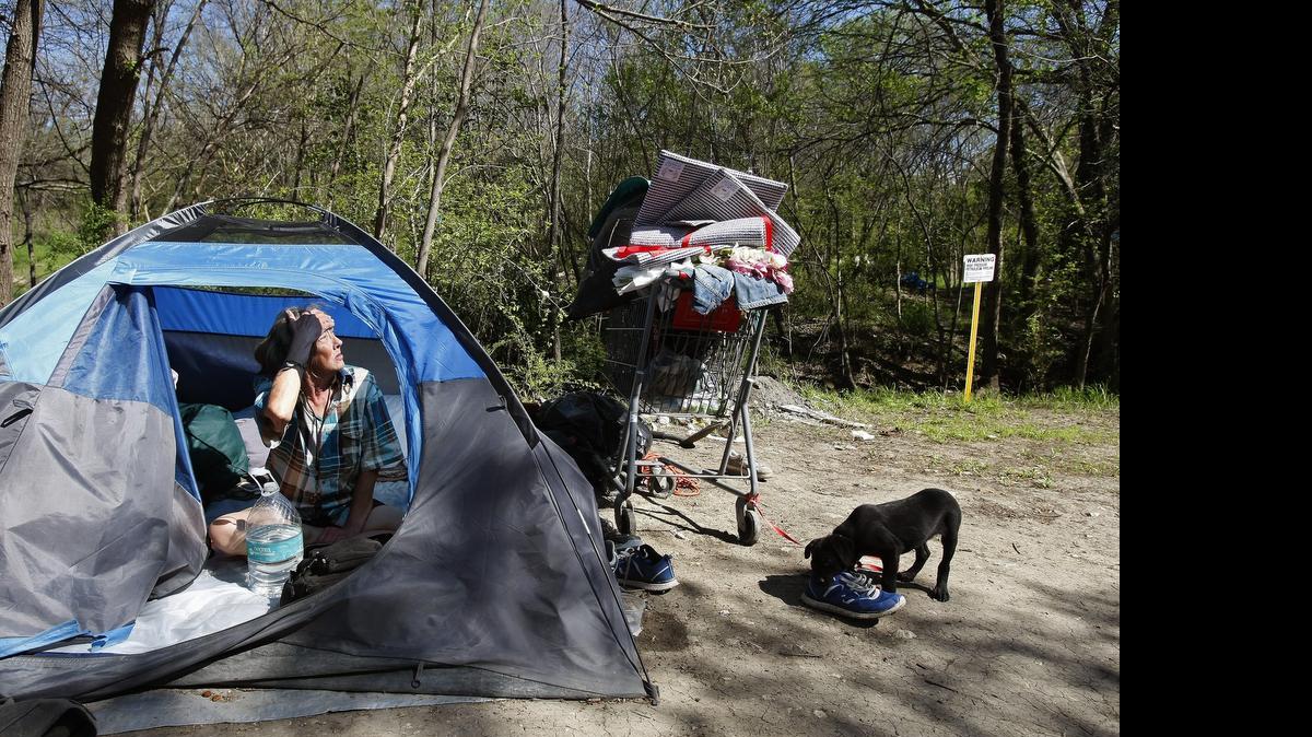 
Angel Coleman is one of several homeless people living in a homeless tent camp in Fort Worth on Thursday, March 26, 2015. Code Compliance vacated the area. 

