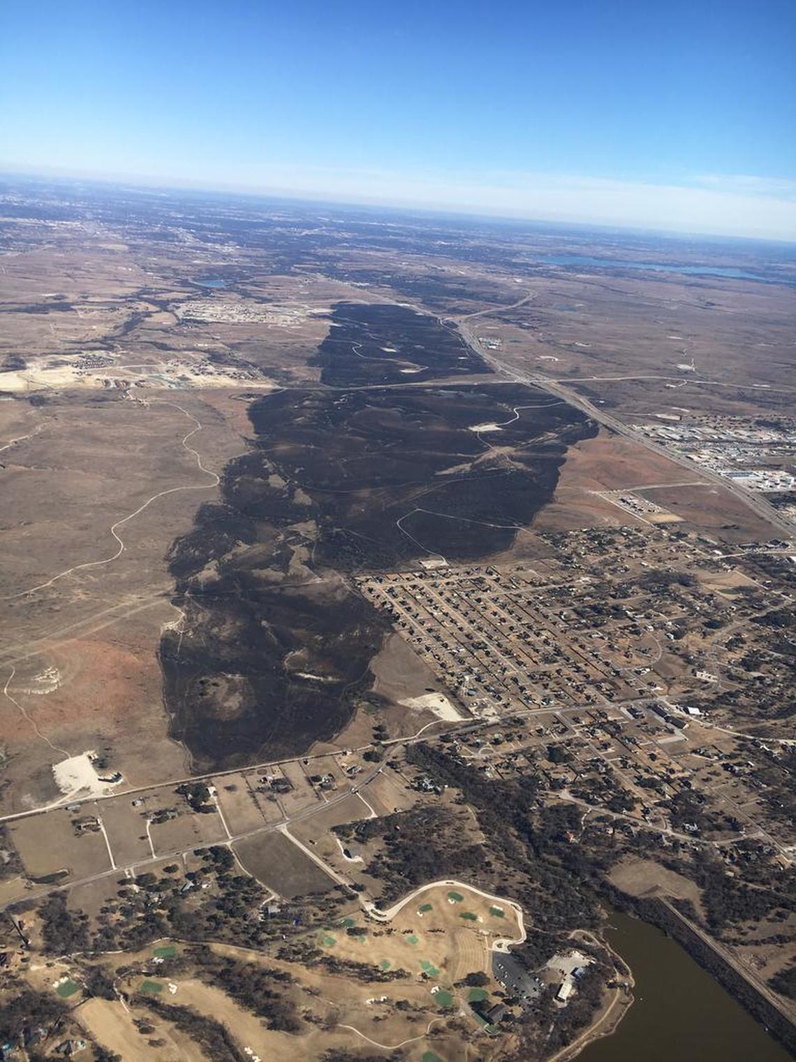 An aerial view of the scorched ground caused by the 2,153-acre Farmers Road fire that burned on Jan. 22 from Willow Park to the edge of the Walsh development in far west Fort Worth.
