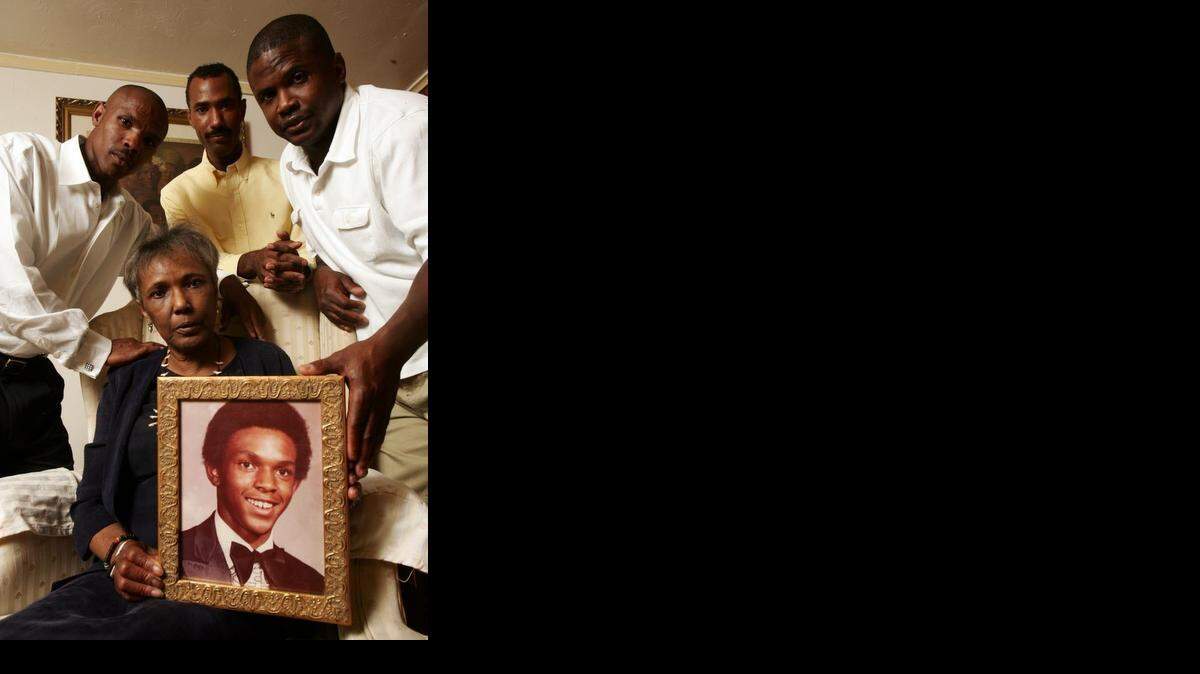 
Ruby Session (bottom) holds a photo of her son Tim Cole, who died in prison for a crime he did not commit. DNA tests have now cleared him of the Lubbock County rape, and she is seeking to have his record cleaned. Also in the photo are her sons (l-r, top) Rodney Kennard, Cory Session and Reginald Kennard. Photographed Monday June 30, 2008. 
