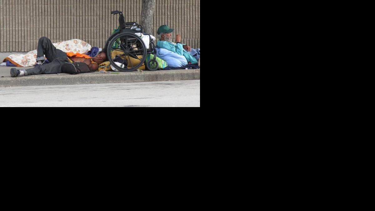 
Homeless men slept during the day outside the Union Gospel Mission this summer.
