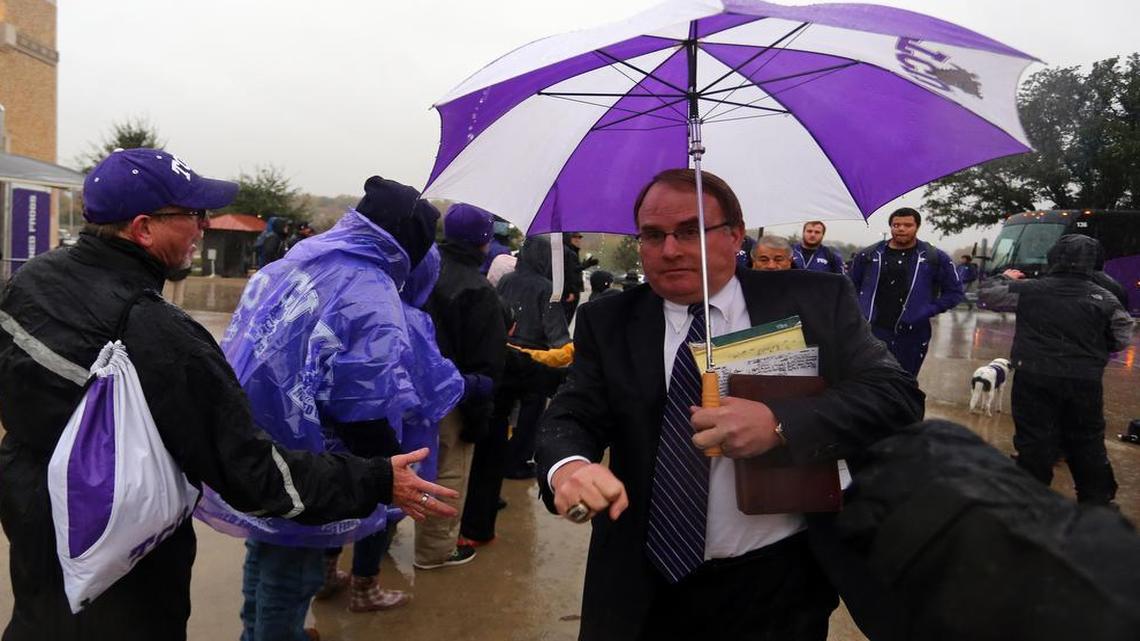 TCU fans greet head Coach Gary Patterson as he arrives with the team at Amon G. Carter Stadium before the game between Baylor and TCU Friday, Nov. 27, 2015.