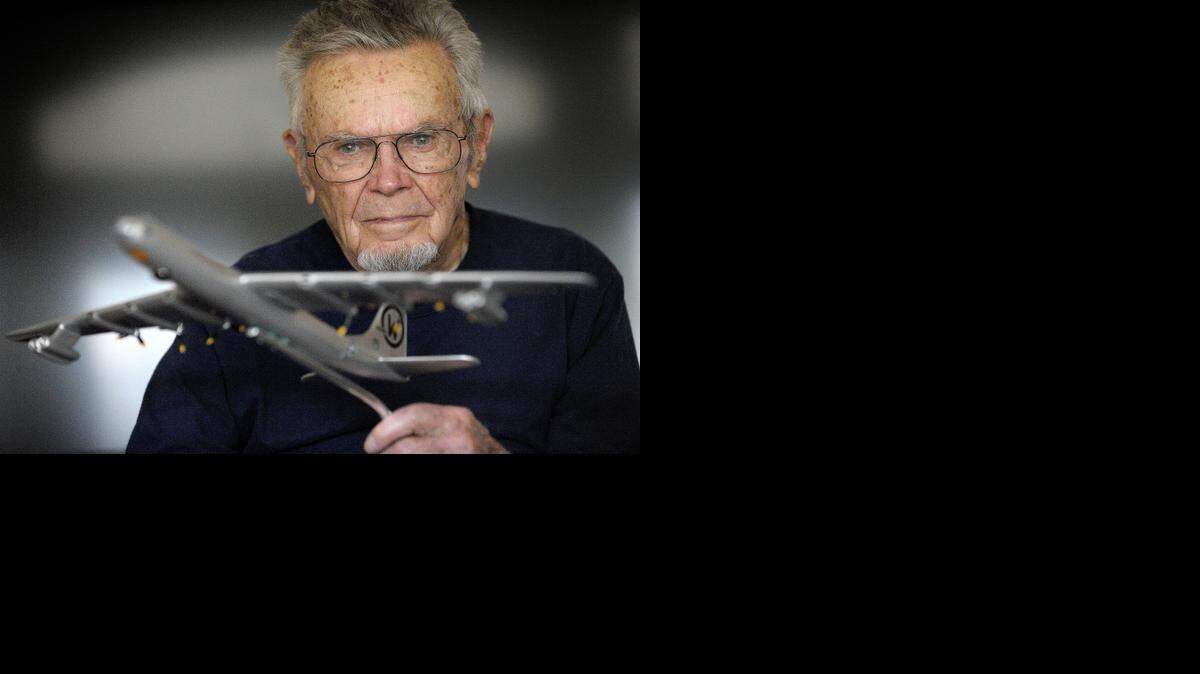 
Dick Thrasher holds a model of a B-36 "Peacemaker" at his home in Hurst. Sixty-five years ago. Thrasher was forced to parachute out of a plane carrying an unarmed nuclear bomb. Thrasher, 93, would survive but five others who jumped out of the crippled B-36 Peacemaker would die.
