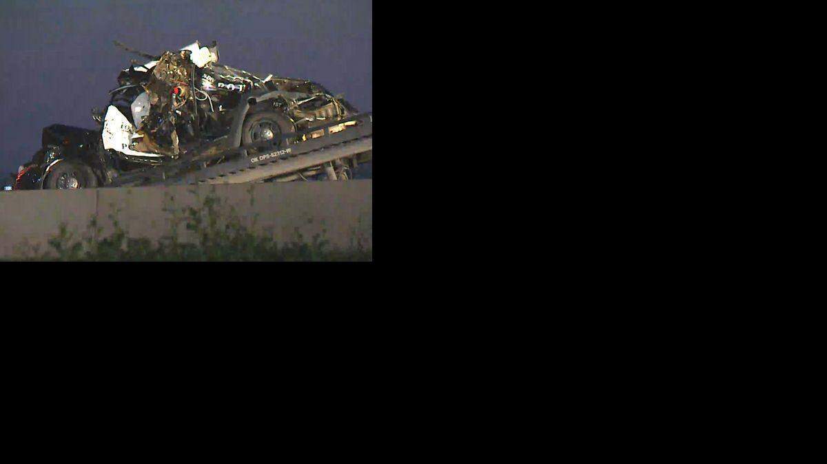 
The remains of a Fort Worth police cruiser are on top of a tow truck early Monday. The car unoccupied when it was struck by a pickup, sending it crashing into a fire truck. Three firefighters were injured.
