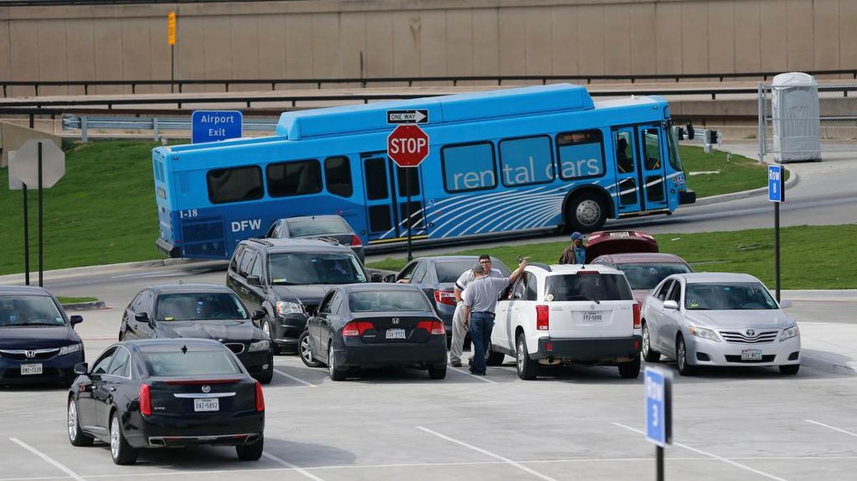 Uber drivers wait in the pre-arranged transportation lot at Terminal A at D/FW. Fort Worth council members questioning why the city should permit vehicle-for-hire companies at the airport.