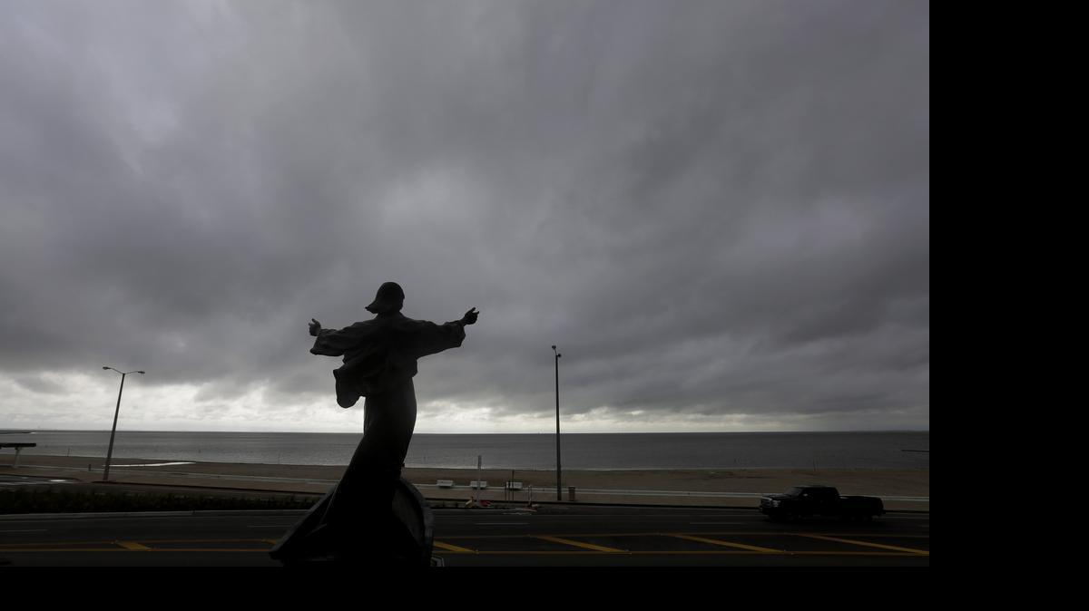 
A statue of Jesus calming the sea faces the bay and Gulf of Mexico in Corpus Christi as Tropical Storm Bill began to make landfall Tuesday morning. The center of the storm was in area of Matagorda County, about 90 miles southwest of Houston.
