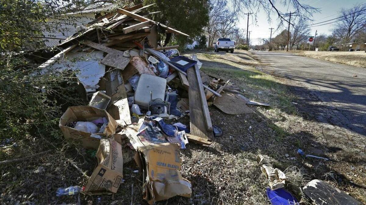 Trash on the side of Elmwood Avenue near McCurdy Street. The Fort Worth City Council will decide whether to make the Ash Crescent neighborhood on the southeast side the next neighborhood to receive tax dollars for revitalization.