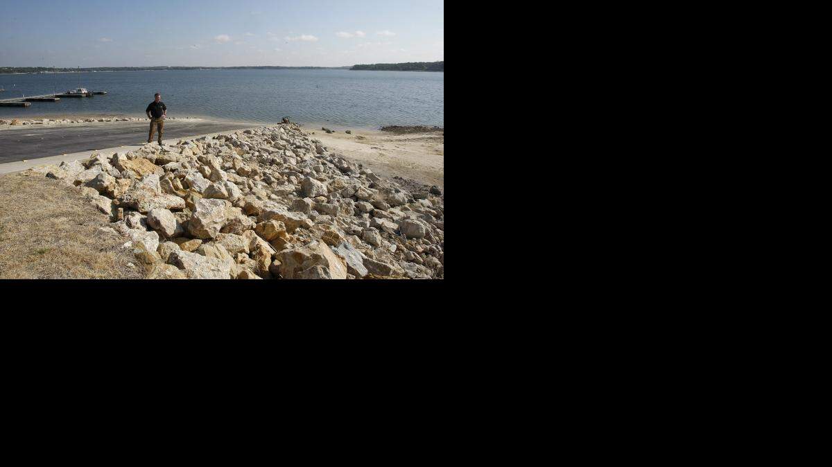 
The drought is continuing to take a toll on area lakes. David Geary of the Tarrant Regional Water District is shown in October standing on a closed boat ramp on Eagle Mountain Lake at Twin Points Park. TRWD’s overall capacity is now at 61 percent.
