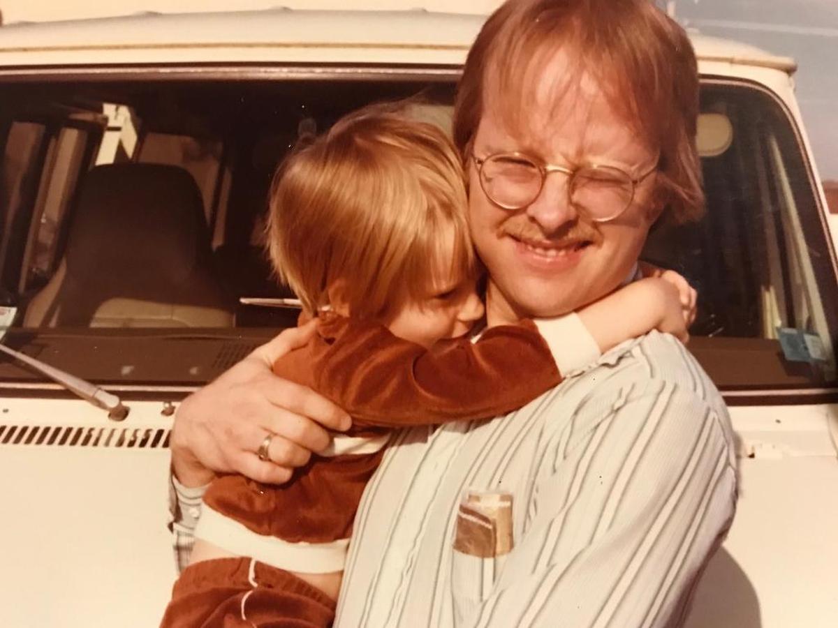 Milton Hatchell holding his son, Joshua.