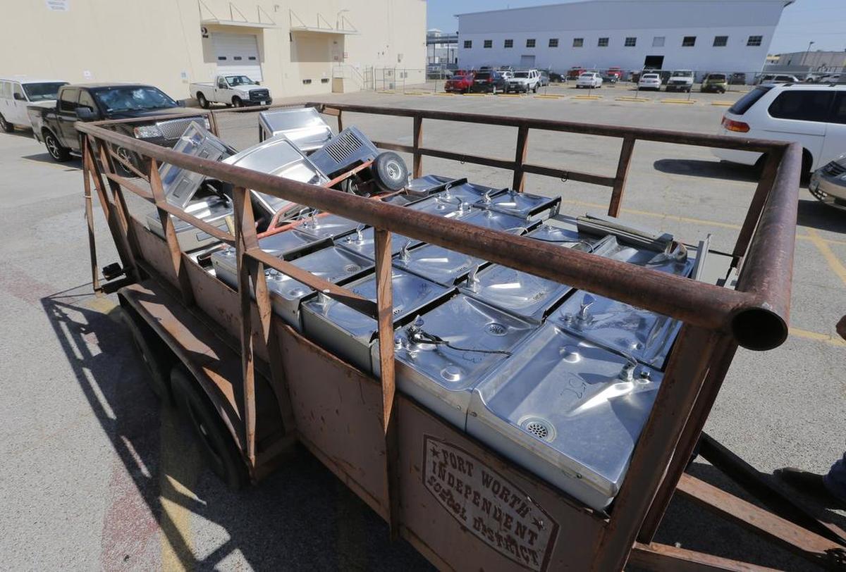 A trailer is loaded with water fountains that were removed from several Fort Worth schools because the design of the fountains allowed water to sit in a tank and collect metals, including lead, at higher-than-llowable levels.