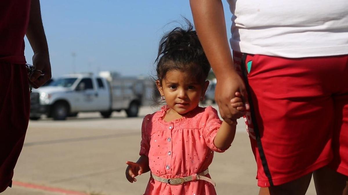 A young Hurricane Harvey evacuee checks into the Wilkerson-Greines Activity Center in Fort Worth with her parents earlier this week.