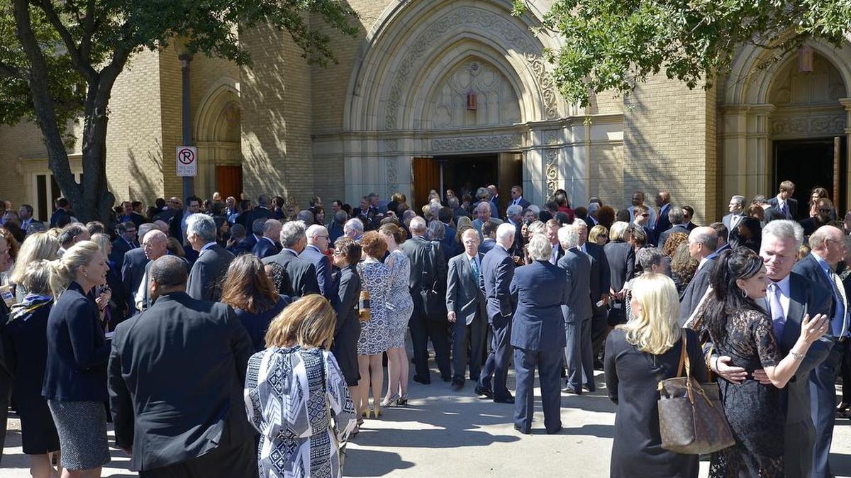 
People stop to visit after service for t Richard Rainwater on Friday, Oct. 2, 2015.
