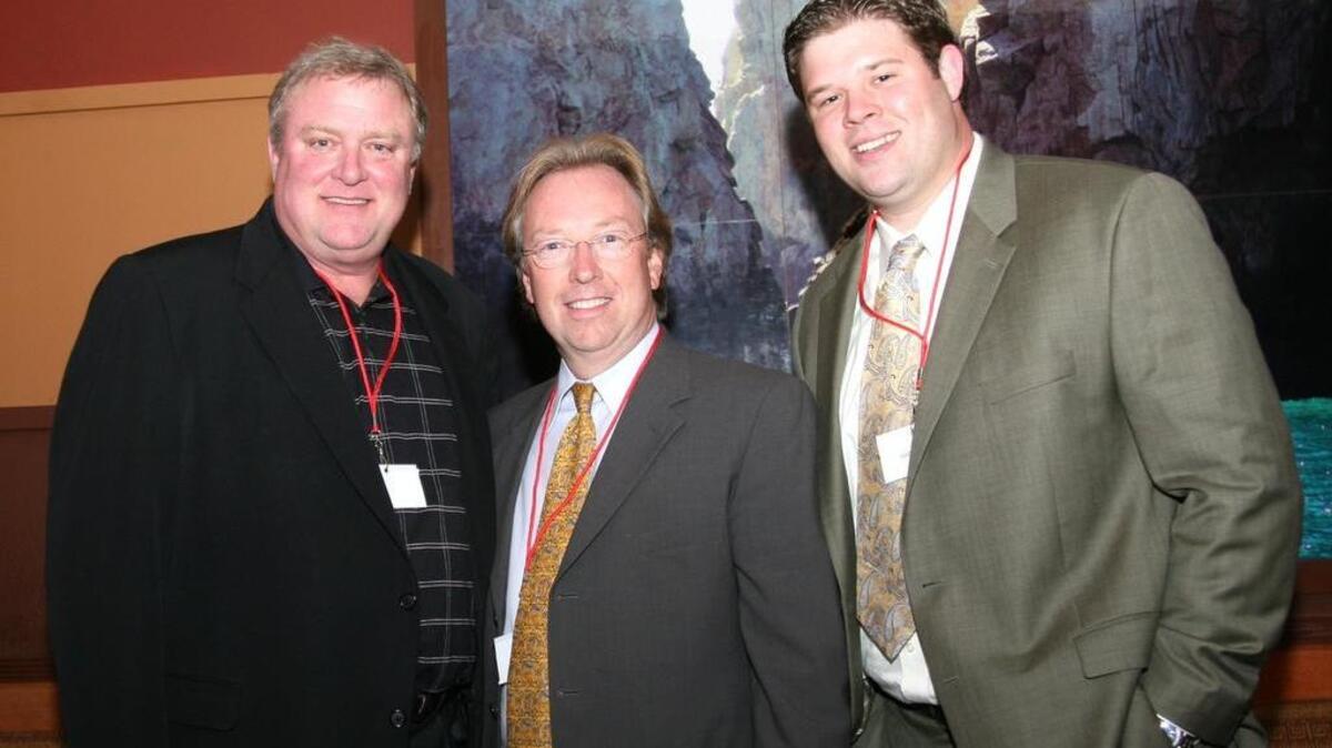 Josh Harbuck, right, and his father, Hall Jay, left, along with Bobby Feather in a 2008 file photo.