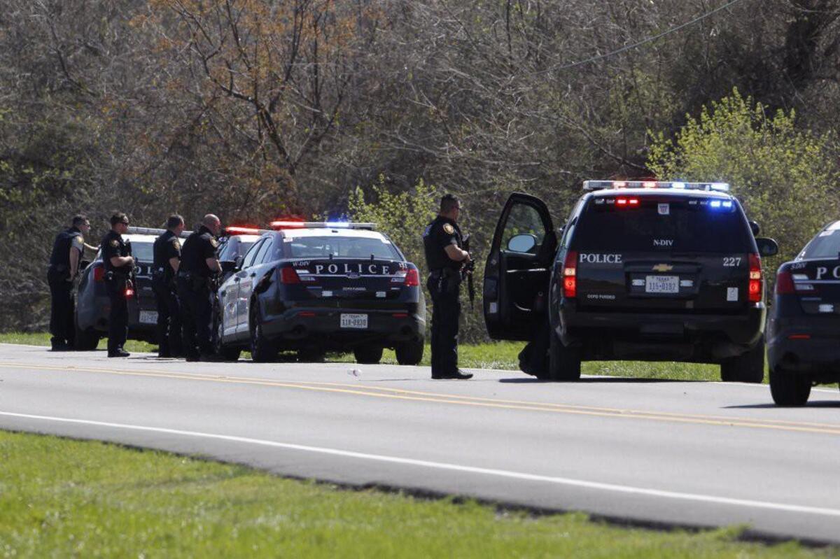 Heavily armed Fort Worth police officers on the scene in west Fort Worth where an officer was wounded Tuesday.
