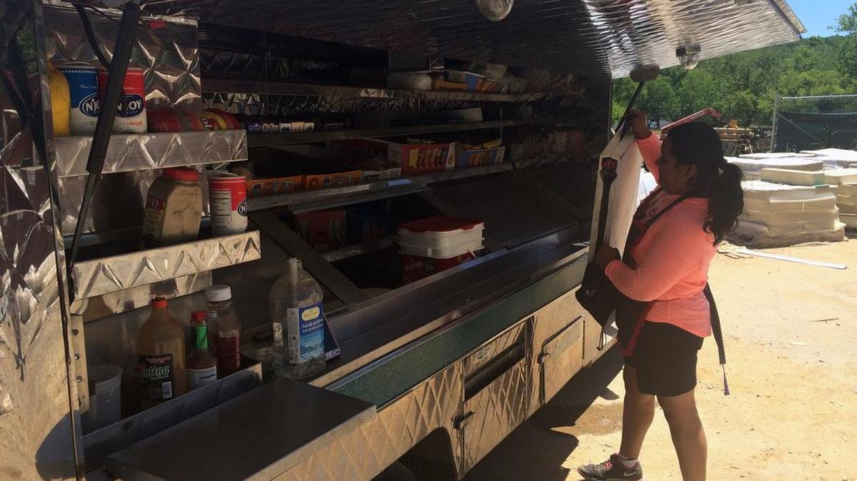 In this May 16, 2017 photo, Nancy Vasquez, a Salvadoran citizen with a short-term and renewable legal immigration status in the U.S. called Temporary Protected Status (TPS), cleans up her food truck at a construction site in Rockville, Md. Immigrant allies want the federal government to renew El Salvador’s TPS program.