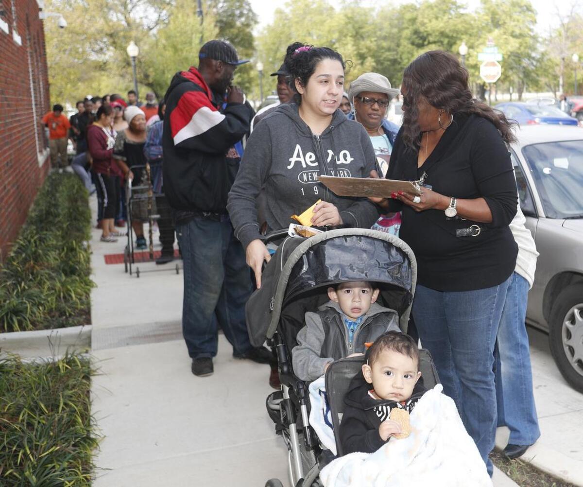 Melinda Hamilton with East Fort Worth Neighborhood Coalition registers families to receive Thanksgiving food baskets at Bethlehem Center in a 2016 file photo.