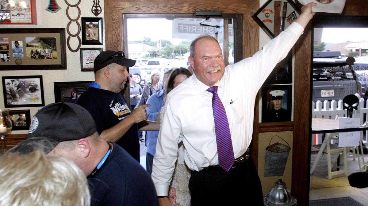 A jubilant Bill Wayborn is greeted by supporters as he enters his campaign watch party at Saljos Pizza and Italian Cuisine in Pantego.