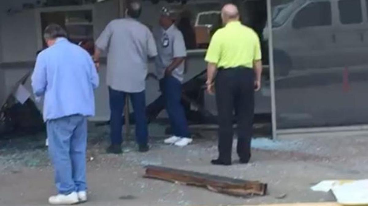 The broken window where an ATM was stolen at the FWISD administration building Wednesday.