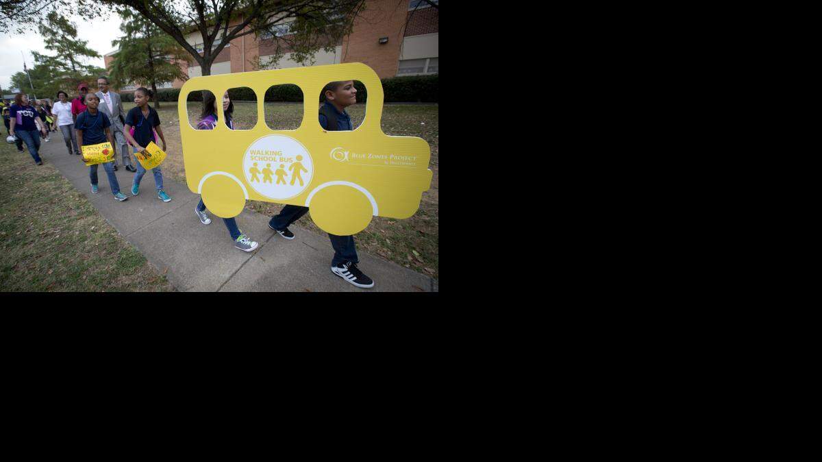 
Students, teachers, parents and dignitaries joined the walking school bus to C.C. Moss Elementary on International Walk to School Day on Oct. 8, 2014. Tarrant County Voices for Health, the TCU Harris College of Nursing & Health Sciences and the Blue Zones Project participated in the project. 
