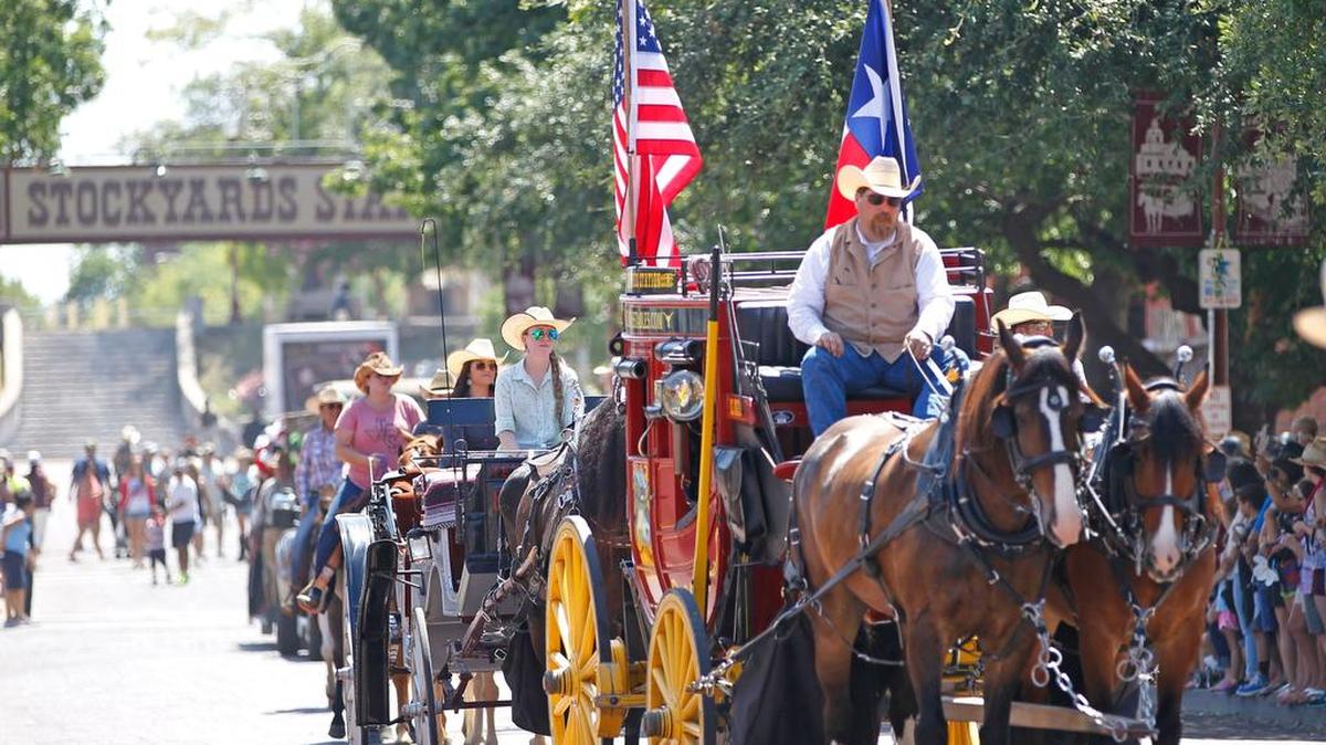 A stage coach is part of a parade on East Exchange Avenue during the Day of the American Cowboy celebration at the Stockyards in July.