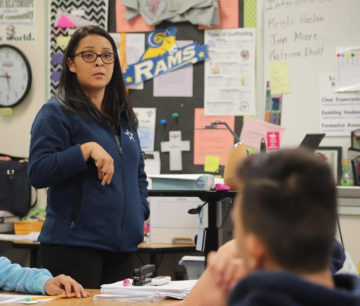 Claudia Jacobo Martinez, a DACA participant, teaches her seventh-grade reading class at the International Newcomer Academy in Fort Worth.