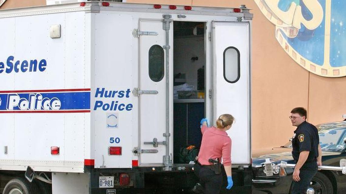 Hurst Police crime scene investigators at the Putt Putt Golf and Games, 700 E. Loop 820, on October 16, 2006, where Jonas Cherry was discovered inside the business shot to death.