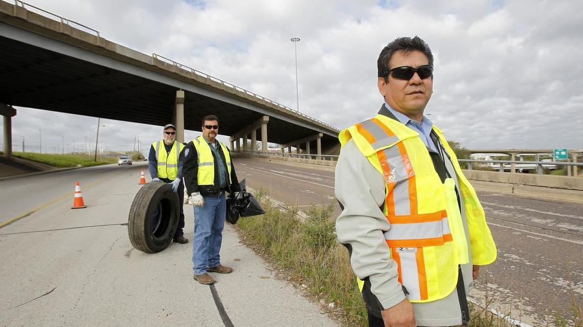 German Vazquez, field operations superintendent for Fort Worth code compliance department leading a crew on East Lancaster in Fort Worth on Tuesday.