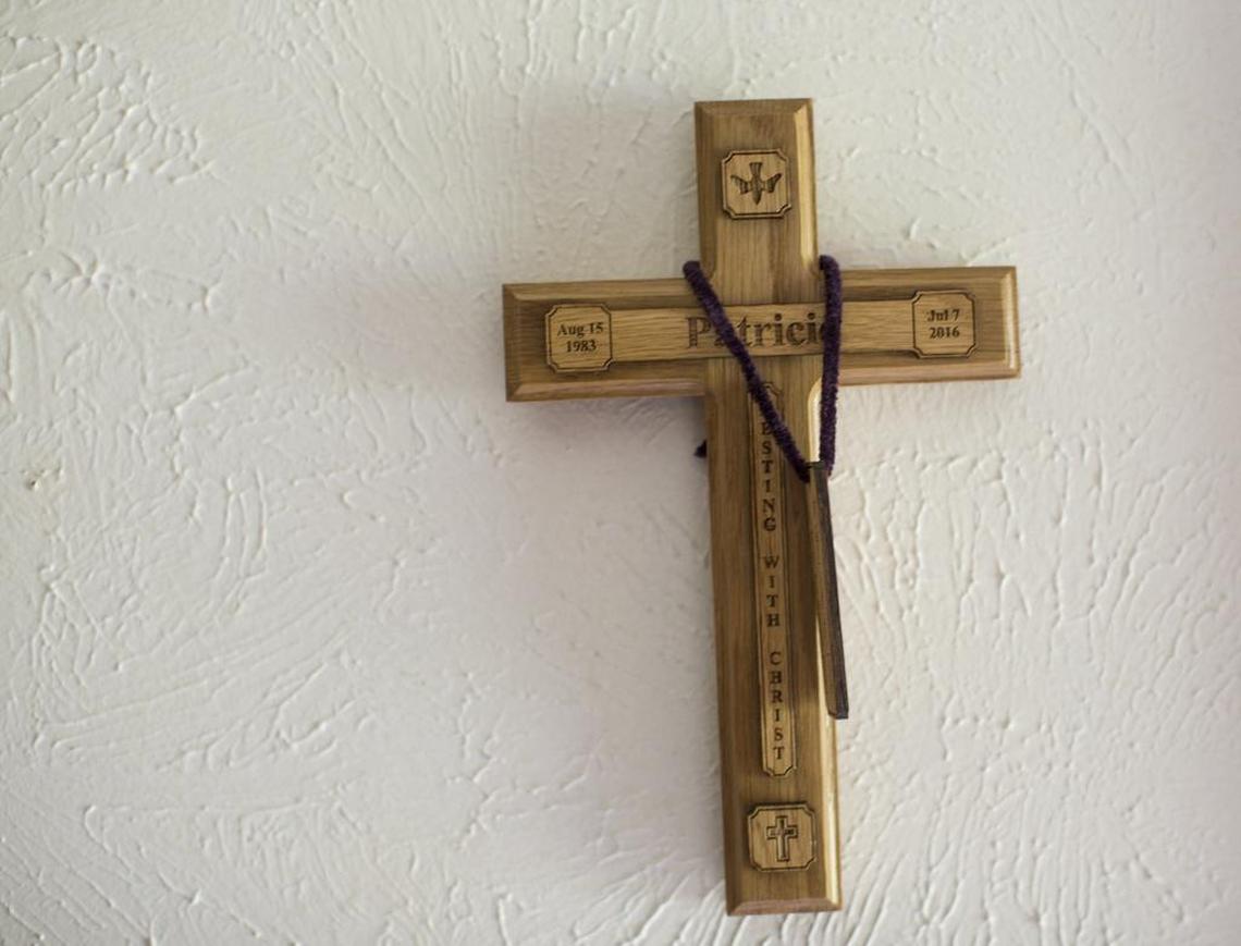 A cross hangs on the wall of Valerie Zamarripa's home in honor of her son Patrick.