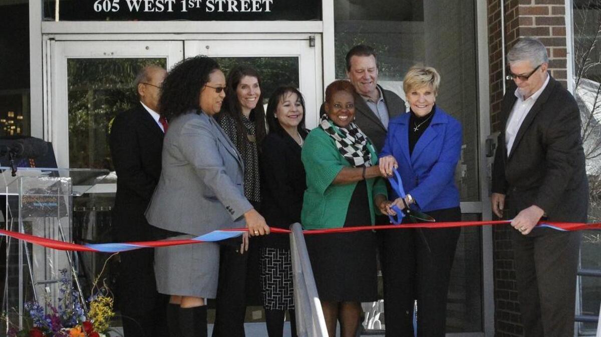 Mayor Betsy Price, in blue jacket, and other officials at the ribbon-cutting of Hunter Plaza Urban Residences in Fort Worth on Wednesday, Feb. 24, 2016
