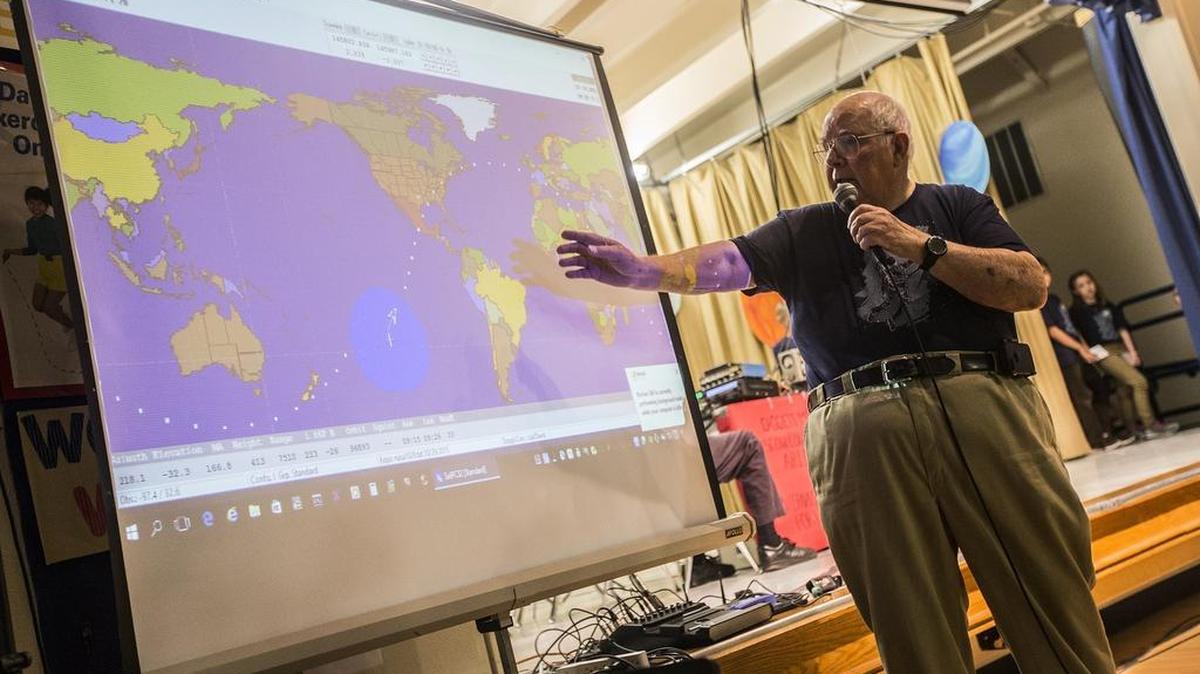 Cowtown Amateur Radio Club member Keith Pugh explains to students how they are able to talk to the International Space Station.