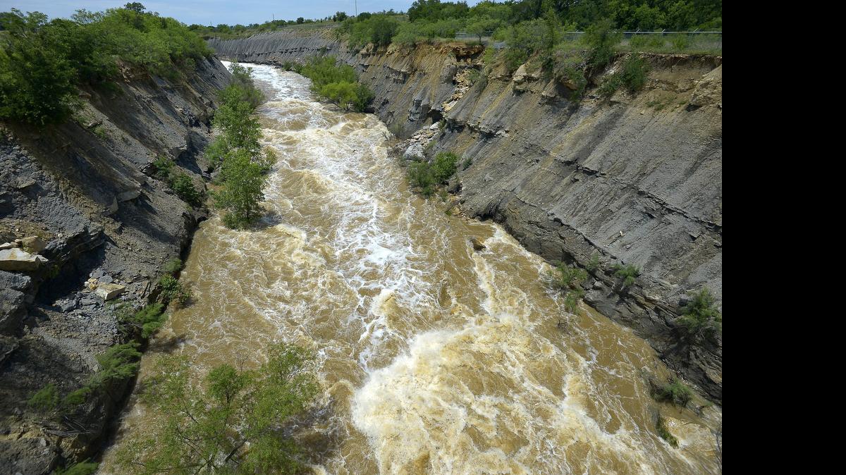 
Water raged out of Lake Bridgeport on Monday, causing flooding downstream, including in Bridgeport. The flows haven't peaked yet and may not for several days. 
