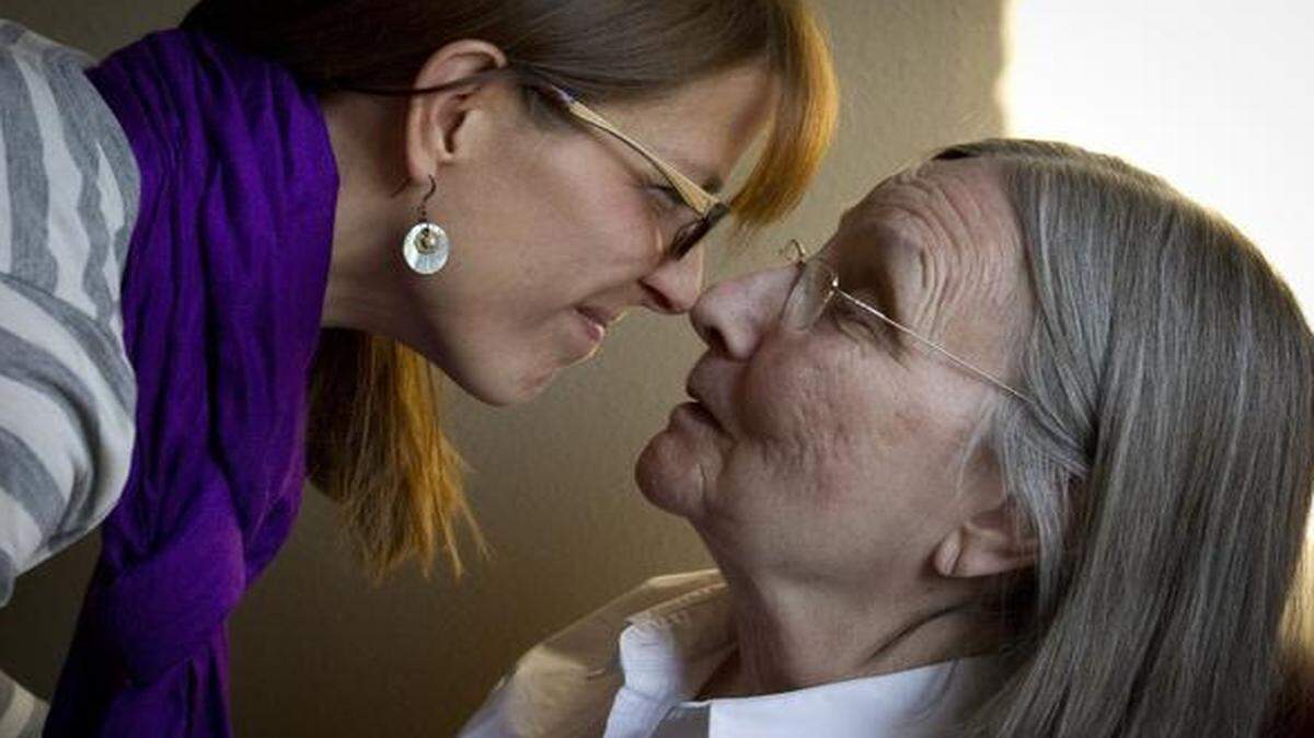 
Ellen Brown, 45, of Weatherford, is considering enrolling her mother, Sue Smith, 77, in Alzheimer's drug trials at UNTHSC. She visits her mother, who lives at the James L. West Center in Fort Worth, on Feb. 25, 2015. 
