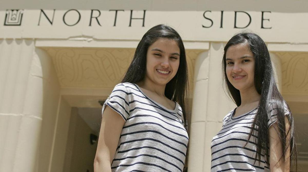 Identical twins Perla and Estrella Ortiz are North Side High School’s salutatorian and valedictorian, respectively. They’ll share the stage Sunday at the Fort Worth school’s graduation ceremony.