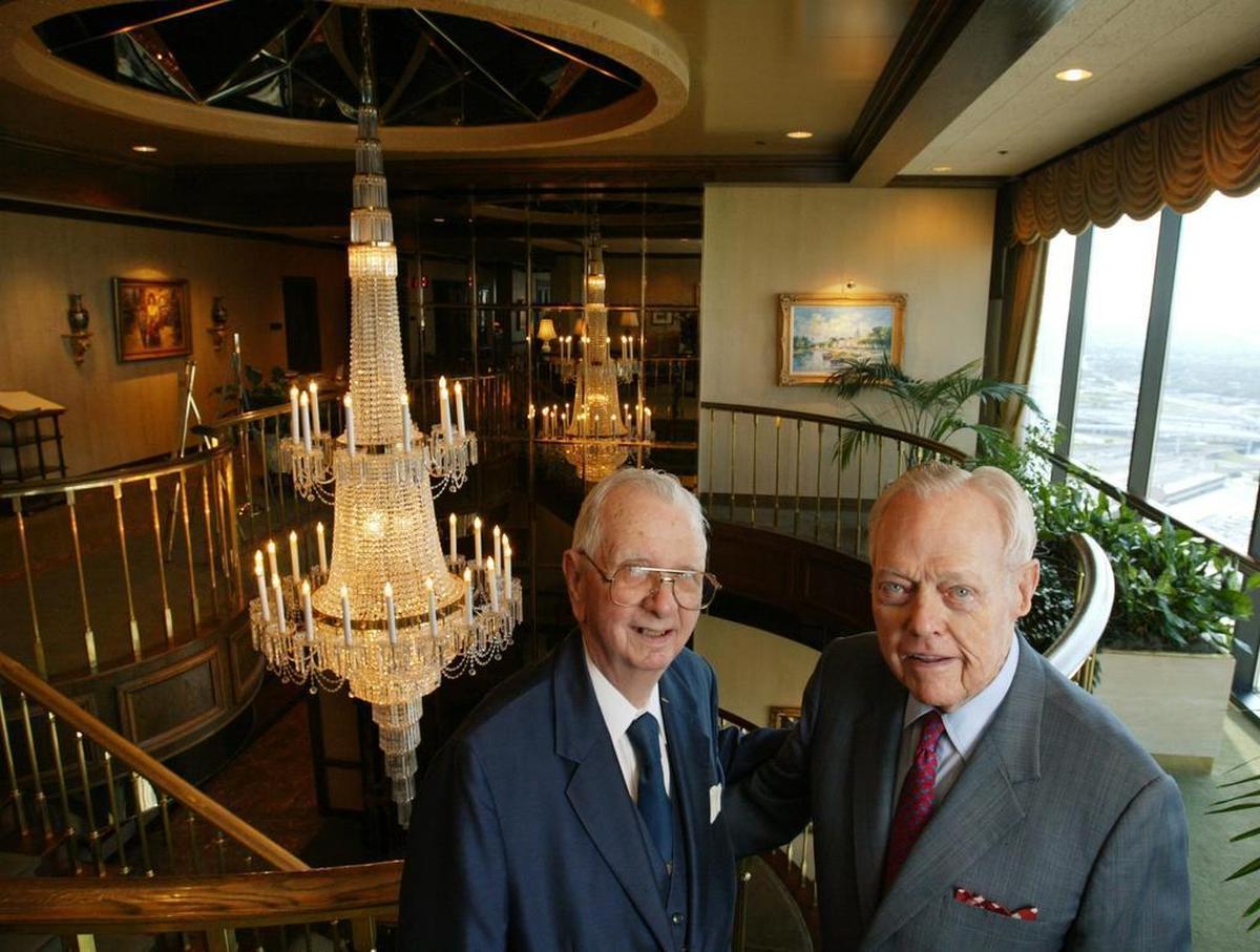 Two of the original members of the Petroleum Club of Fort Worth, Bryan Poff, left, and W.A. “Tex” Moncrief stand in the main lobby of the club.