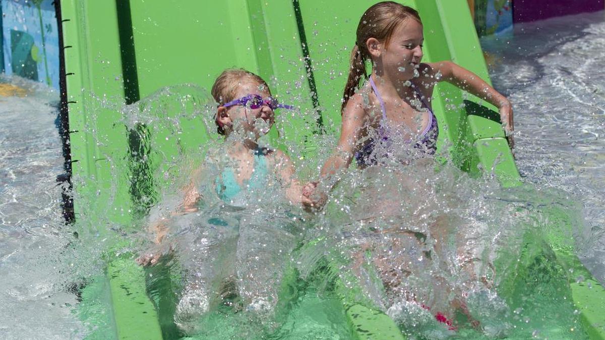 
Lexi, 5, and Paige, 11, Kelly of Bedford cooled off this weekend at the Euless Family Life Aquatics Center.
