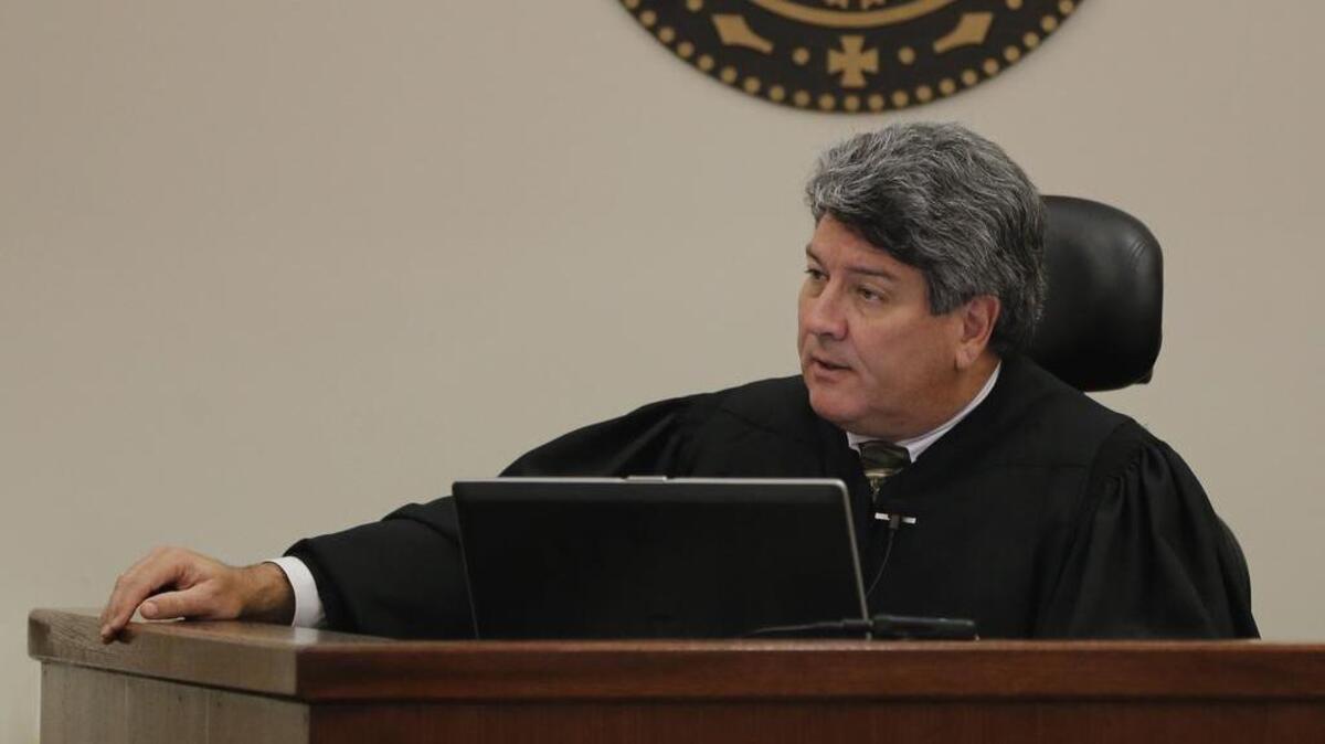 
State District Judge George Gallagher instructs a jury during a 2014 murder trial. Gallagher has been appointed to preside over a case against Texas Attorney General Ken Paxton.
