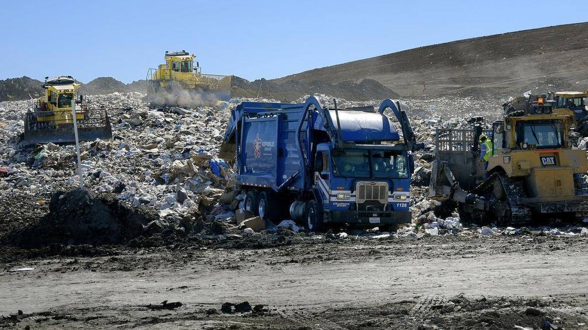 Crews work mounds of trash at Fort Worth’s Southeast Landfill. The city could possibly earn money from the landfill by selling the methane gas it creates.